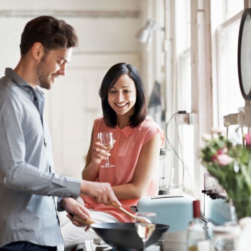 a resident couple making a meal at home at Sandpiper Crescent in Virginia Beach, Virginia