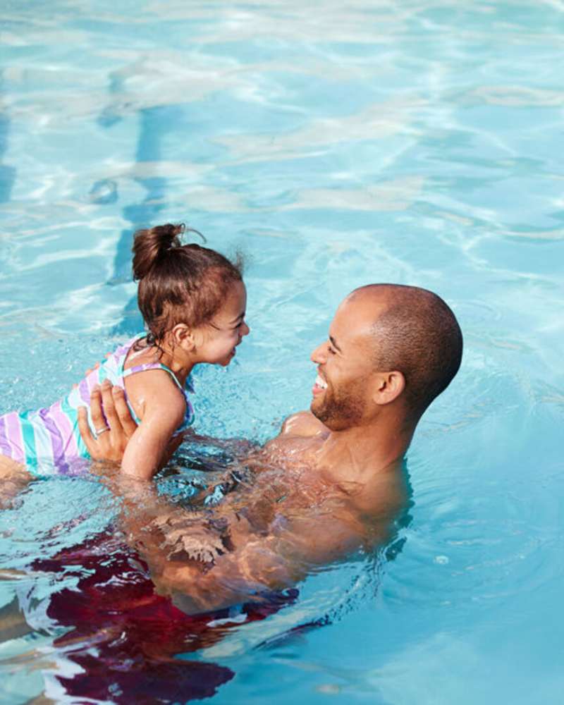 Residents swimming in the pool at Bell Tower at Old Town Square in Wilsonville, Oregon