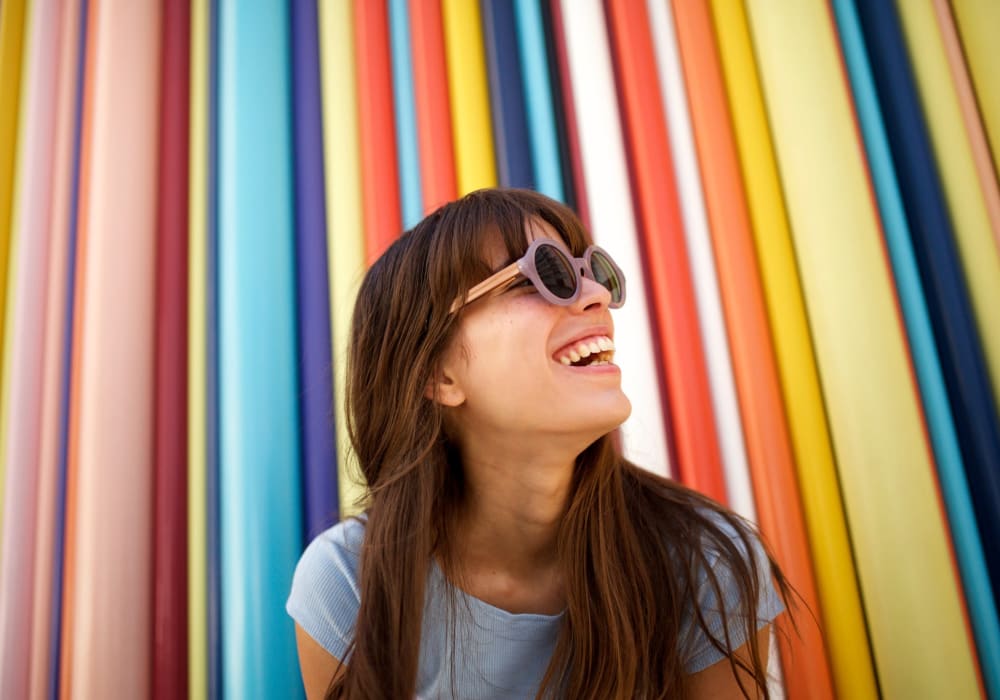 Resident with sunglasses up against a colorful backdrop at Montebello at Summit Ridge in Reno, Nevada