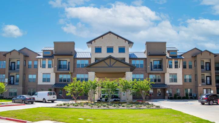 Exterior view of Watermere at the Preserve in North Richland Hills, TX, showcasing upscale independent living community entrance.