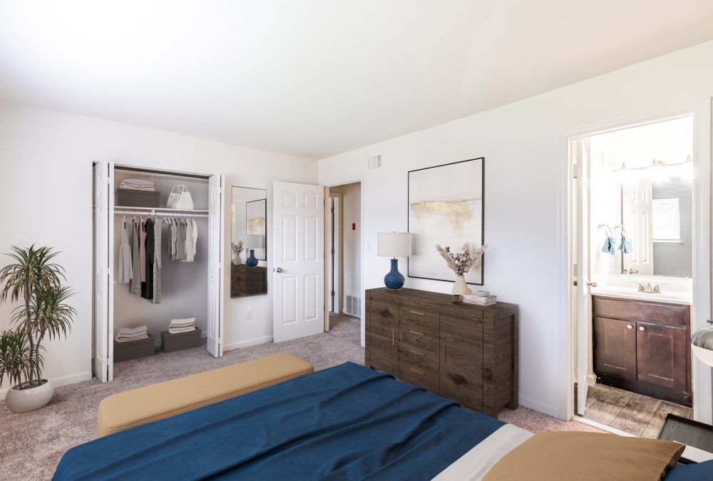Bedroom with attached bath and wall to wall carpeting at Tanglewood Terrace Apartment Homes