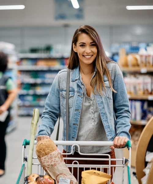 Resident shopping in grocery store near The Seven At West Boca in Boca Raton, Florida
