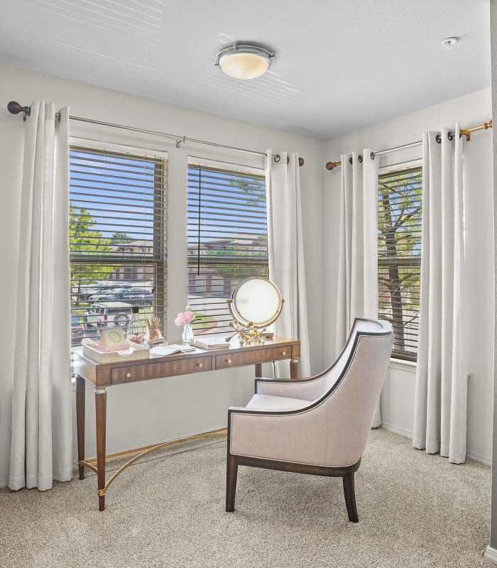 Home office with large windows at Icon at Broken Arrow in Broken Arrow, Oklahoma