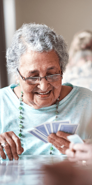 Resident playing a game of cards at The Manor at Market Square in Reading, Pennsylvania