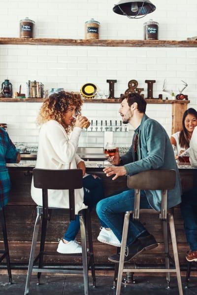 Man and woman enjoying some coffee at a cool cafe near Rivertop Apartments in Nashville, Tennessee