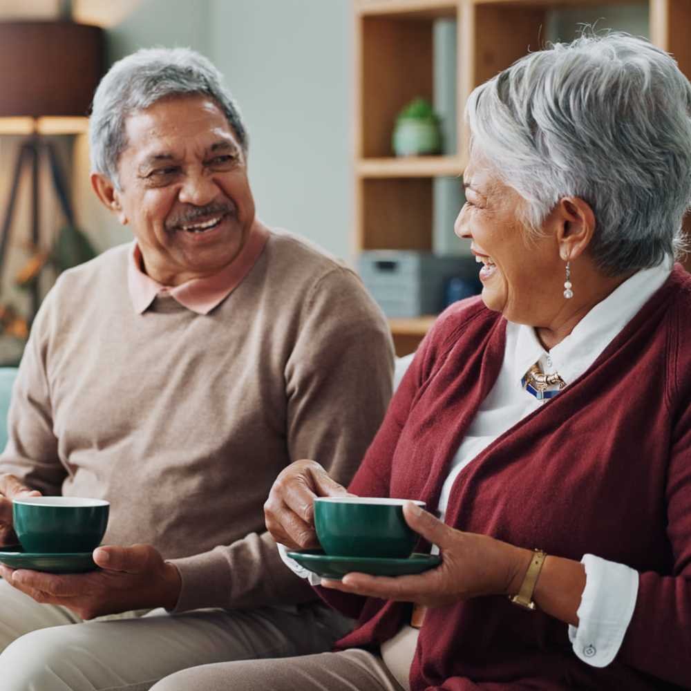 Resident couple enjoying coffee in an apartment at Crescendo in Las Vegas, Nevada