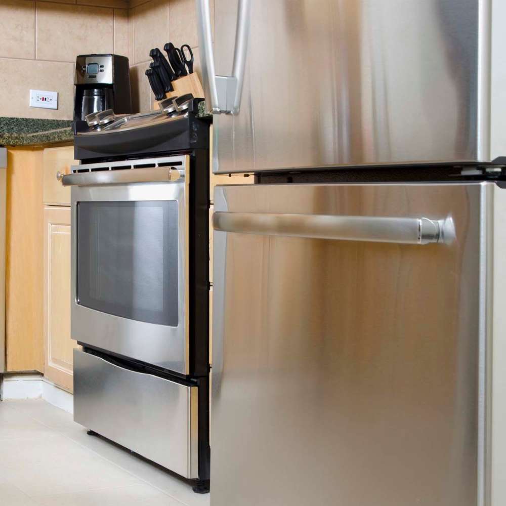 Kitchen with stainless-steel appliances at Brookhollow in Whitesboro, Texas