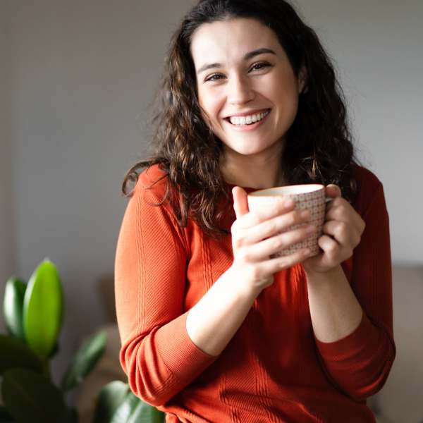Resident enjoying a cup of coffee at North Chase Apartments in Wilmington, North Carolina