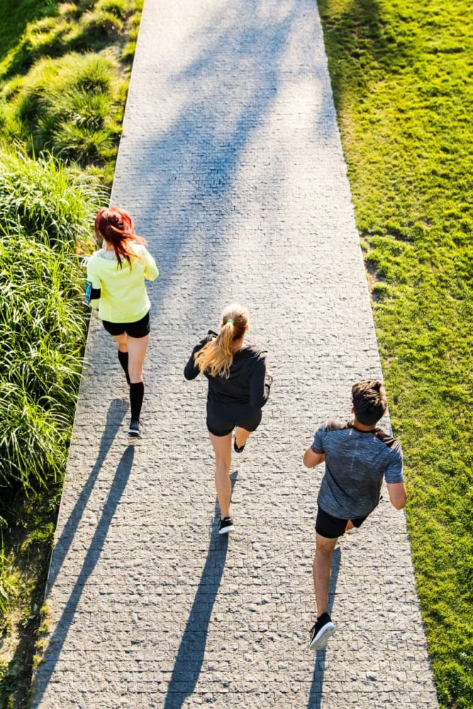 Residents jogging in the park near Plum Tree West Apartments in Gilroy, California