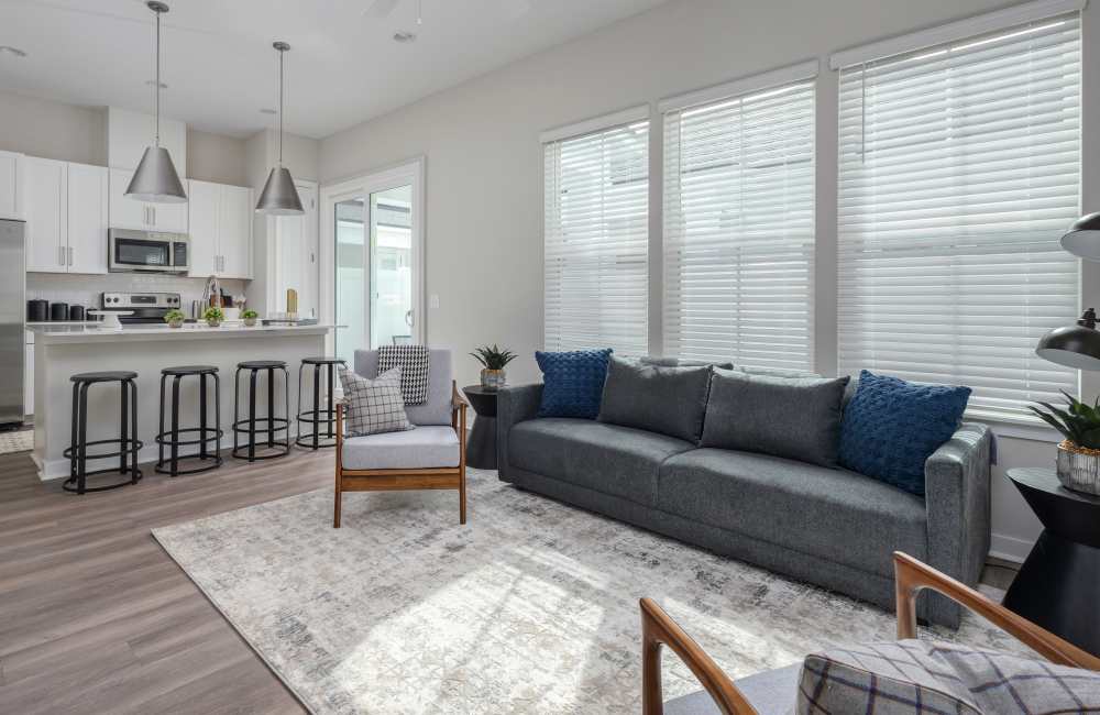 Stylish living room with neutral color palette at Cottage Street at eTown in Jacksonville, Florida