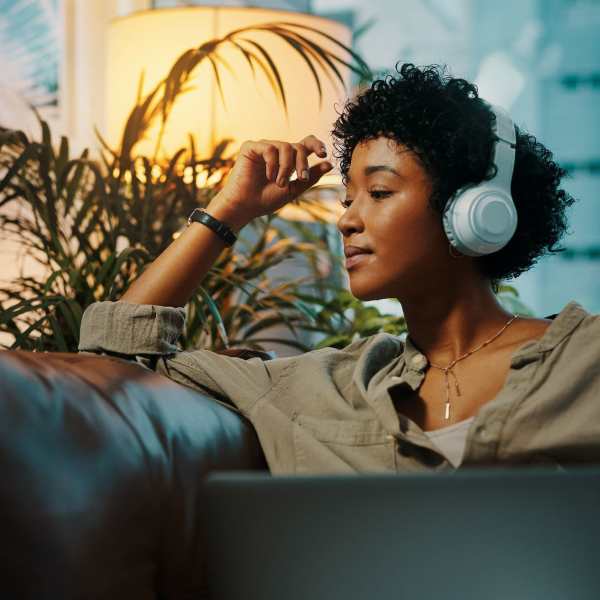 A resident listen to music with her headphones in her apartment at Mason Avenue, Alexandria, Virginia