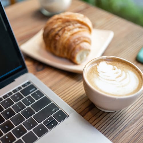 Coffee and croissant with computer at Montebello at Summit Ridge in Reno, Nevada