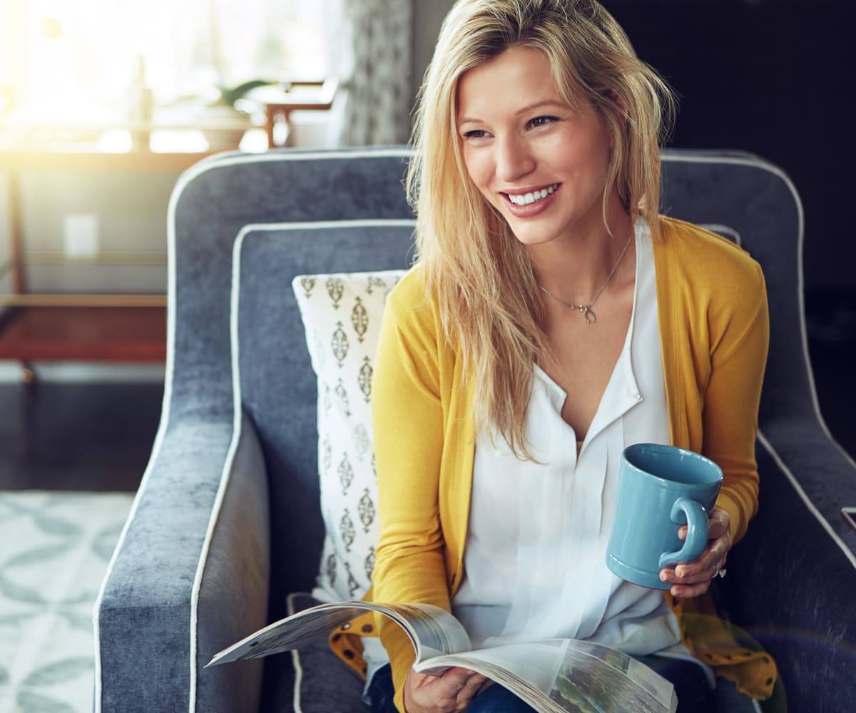 Woman having a coffee in Tulsa, Oklahoma near Cascata Apartments