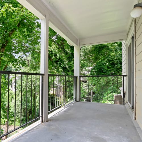 Private balcony with wooded views outside a model home at Crest at Riverside in Roswell, Georgia