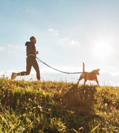 Resident walking their dog in the park near Sagewood Estates in Portland, Oregon