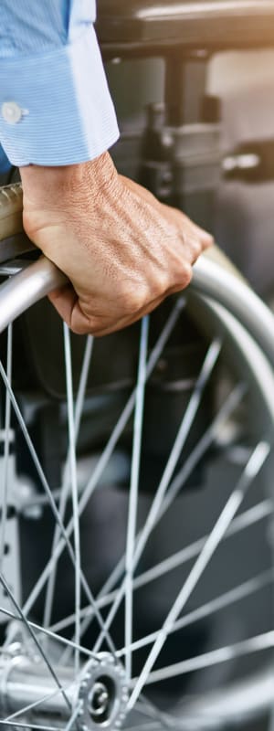 Resident in wheelchair at Lenox on the Lake, Lauderhill, FL