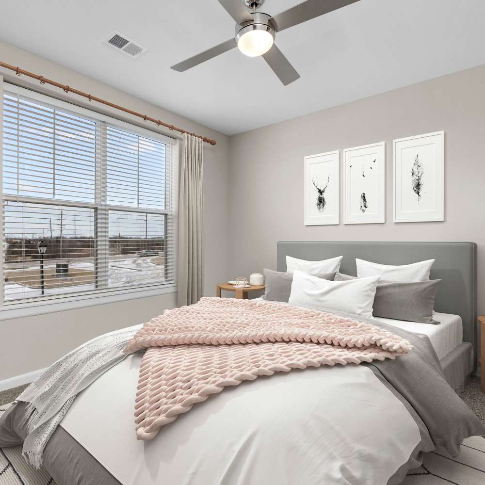 Bedroom with a comfortable bed and a ceiling fan at Citrine at Lake St. Louis in Lake Saint Louis, Missouri