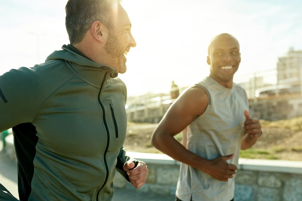 Two men on a jog near Riverstone Apartments in Bolingbrook, Illinois