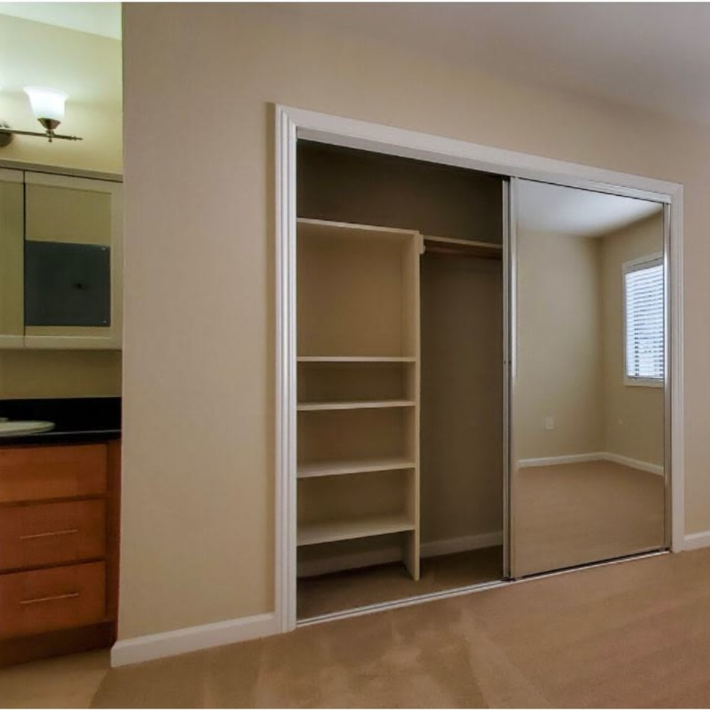 Bedroom with closet and built-ins at Mission Rock at Marin in San Rafael, California