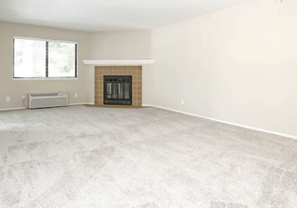 Unfurnished living room with fireplace at Amber Court in Fremont, California