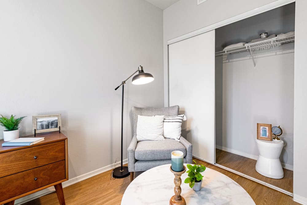 Well-furnished bedroom in a model home at K Street Flats Apartment Homes in Berkeley, California