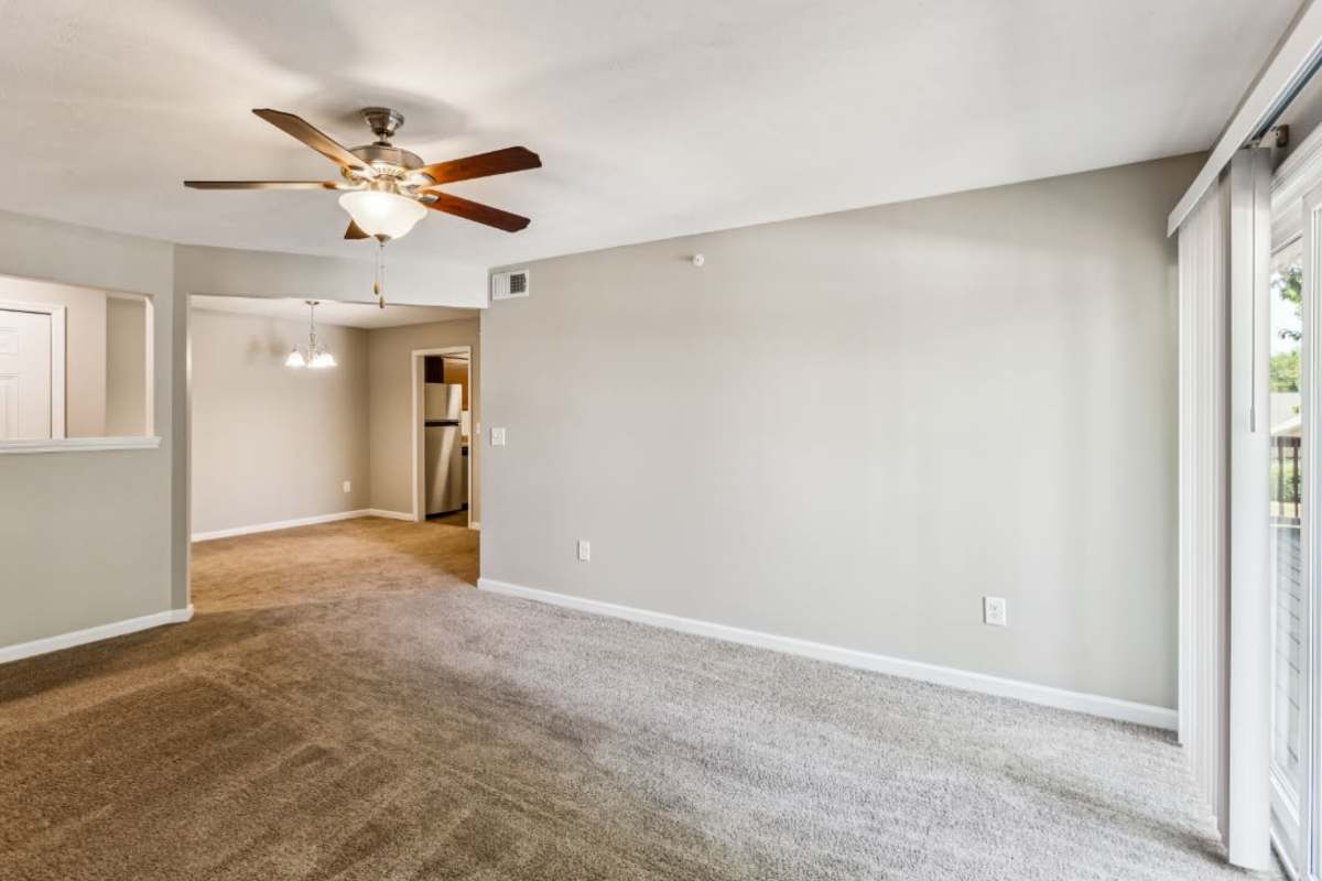 Resident living space with plush carpeting at Ashford Place in Clarksville, Tennessee