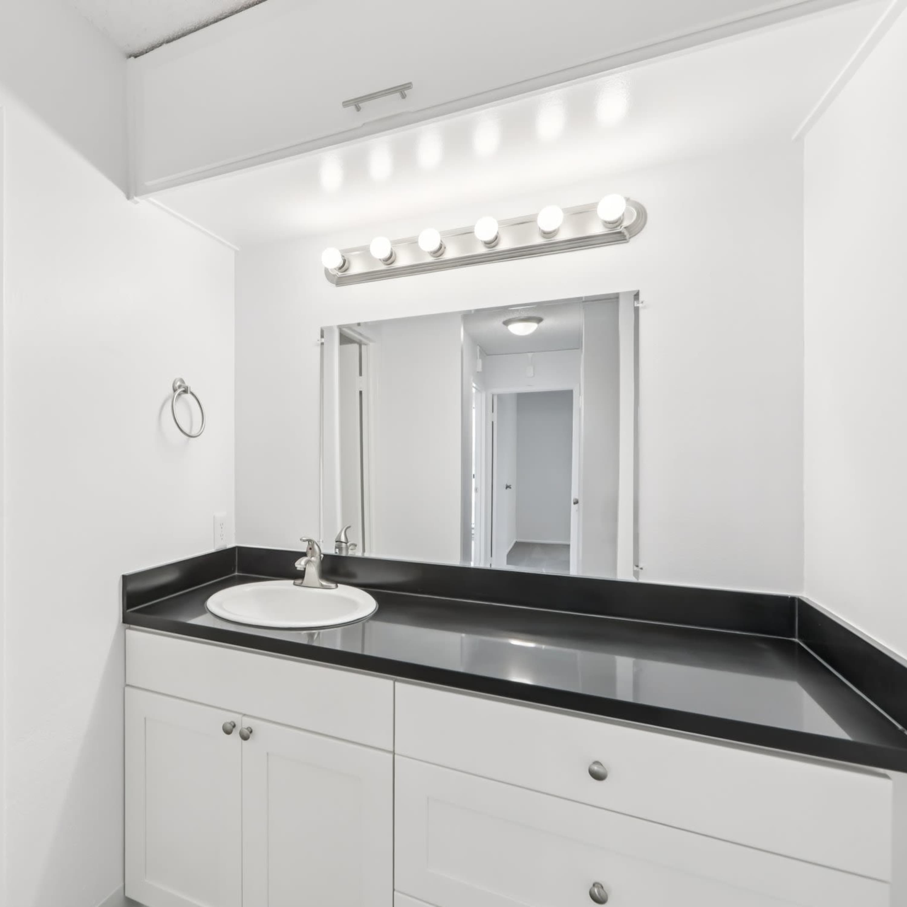 Natural light coming into a bedroom with private balcony at Lakewood Apartments at Lake Merced in San Francisco, California