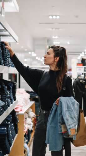 Resident woman shopping at a mall near The Dakota at Governors Ranch in Littleton,Colorado