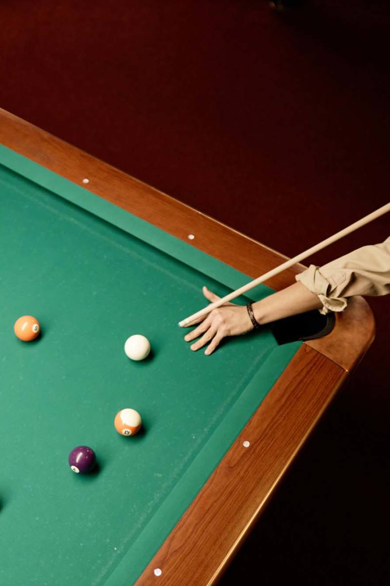 Resident playing in a clubhouse at Arden at South Point Apartment Homes in McDonough, Georgia