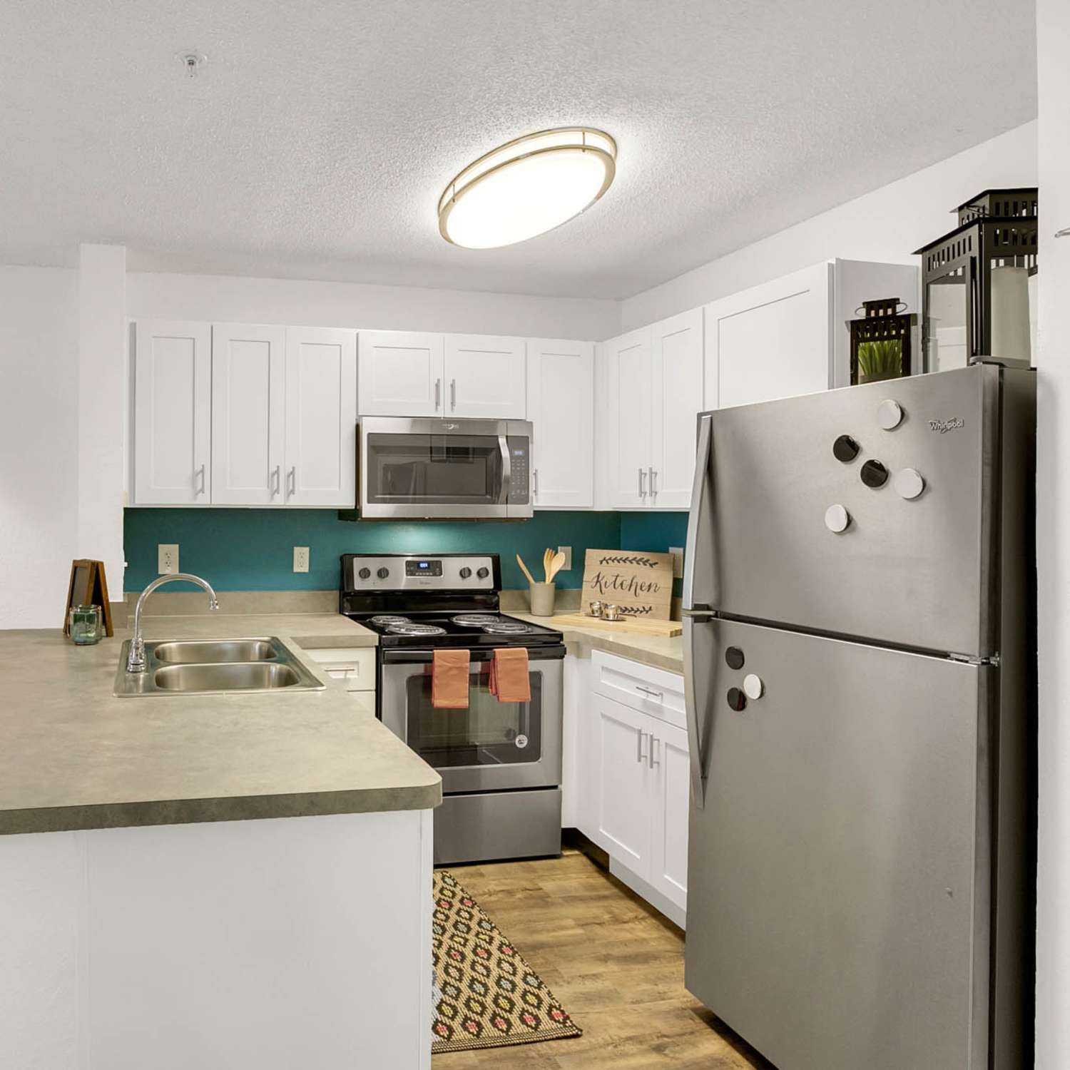 Kitchen with stainless steel appliances at The Quarters Gainesville in Gainesville, Florida