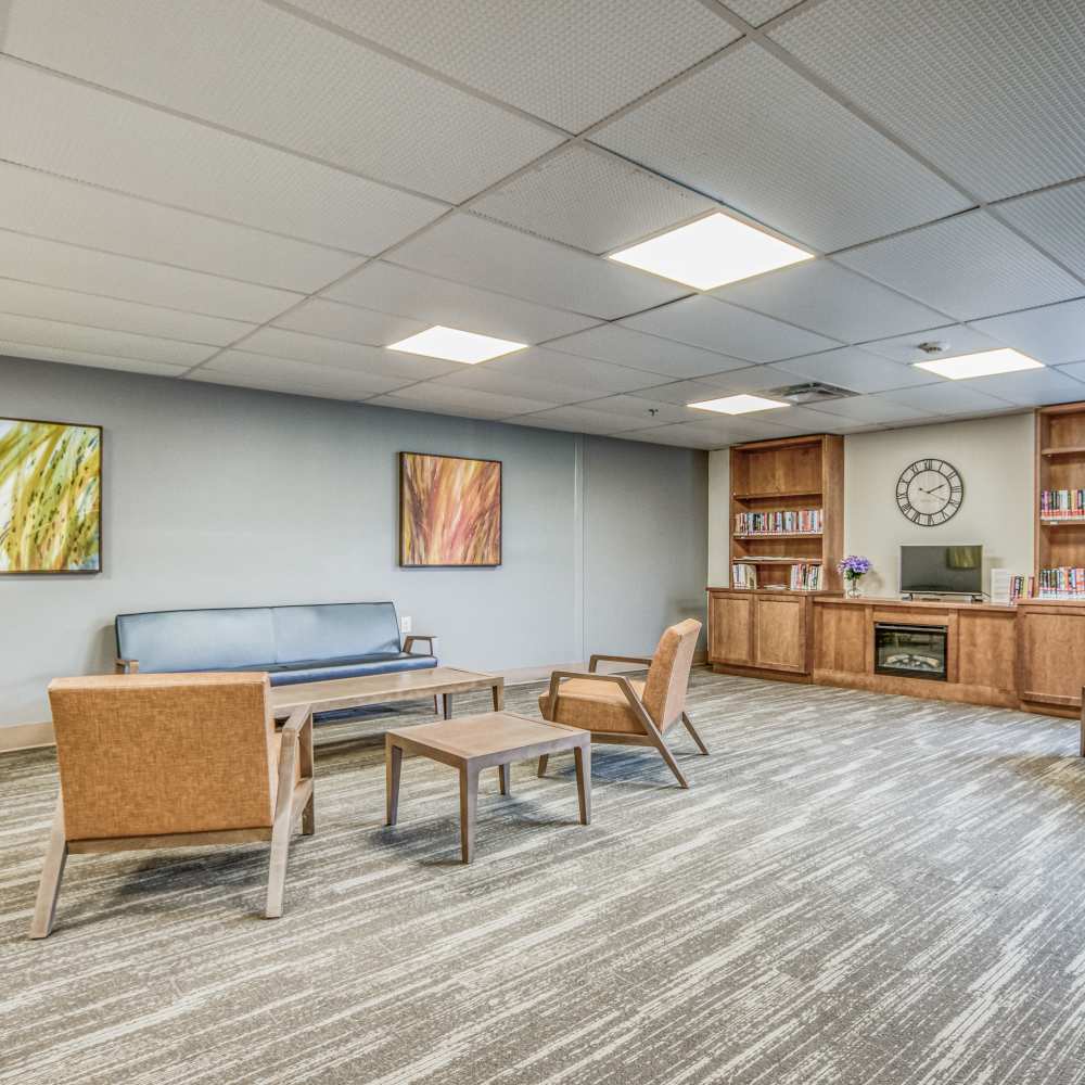 Gathering area with couches and comfortable seating at Lakeland Place in Waterford, Michigan