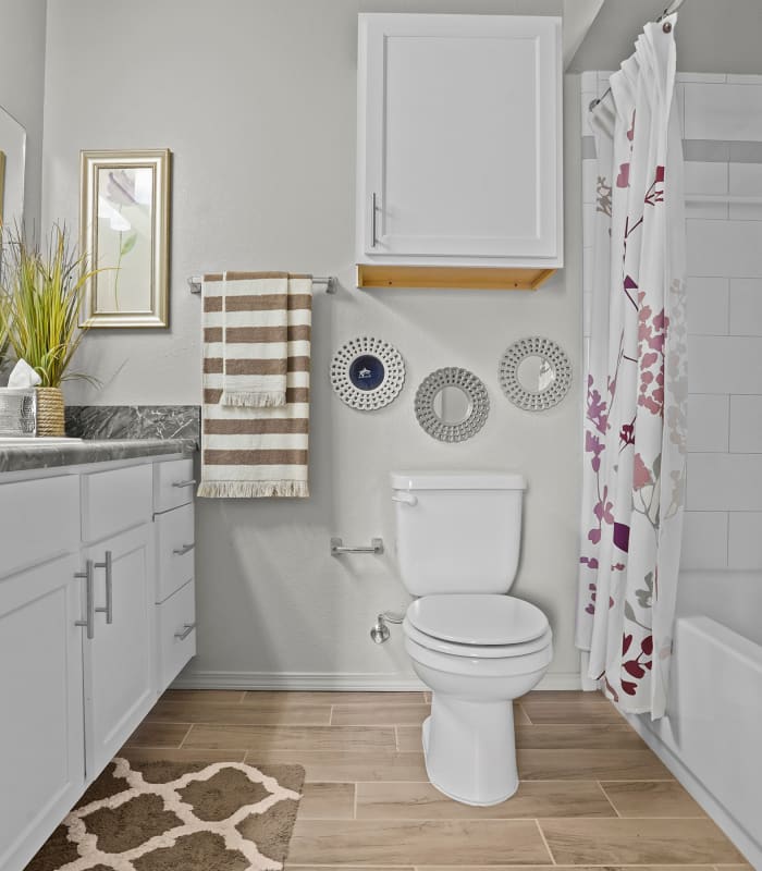 Bathroom with tile flooring at Mission Point Apartments in Moore, Oklahoma