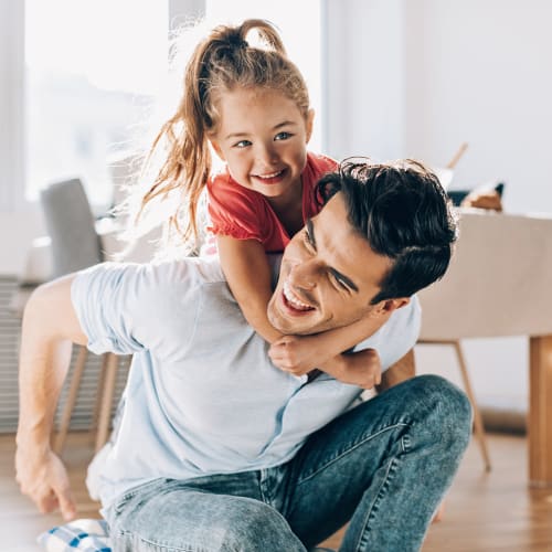 A father and daughter in a home at Eucalyptus Ridge in Lakeside, California