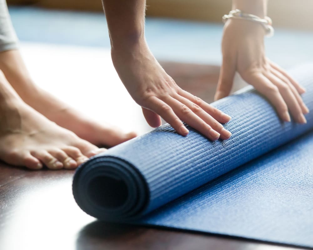 Rolling up the yoga matt after a fun class at The View on Pavey Square in Columbus, Ohio