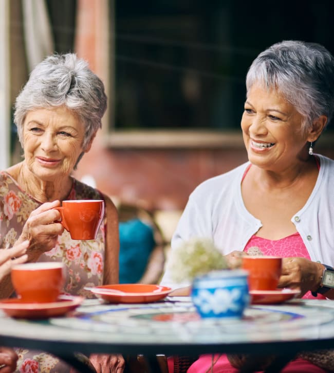 Smiling residents drinking coffee near Olley Glen in Fairfax, Virginia