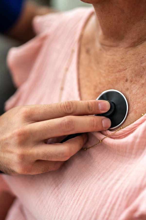 Photo of resident getting care from Merrill Gardens at Rolling Hills Estates's employee
