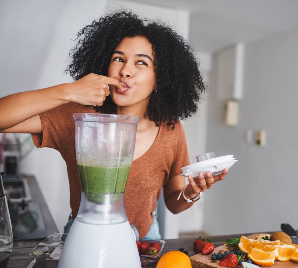 Woman tasting her smoothie at Hopewell Station Apartments in Hagerstown, Maryland