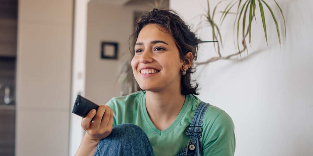 Resident enjoying a movie in her new home at  Capitol Green in Albany, New York