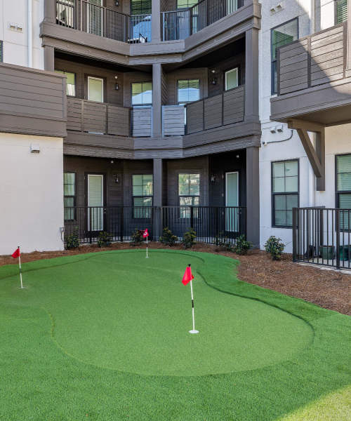 Enjoy a putting green at Palmilla | Apartments & Townhomes in Pensacola, Florida