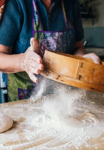 A baker making a dessert at The Claiborne at Thibodaux in Thibodaux, Louisiana