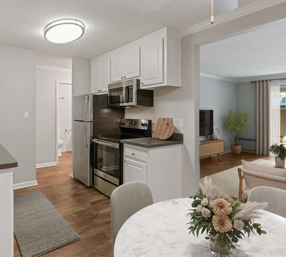 Kitchen with grey counters and white cabinets at Flora Condominium Rentals in Walnut Creek, California