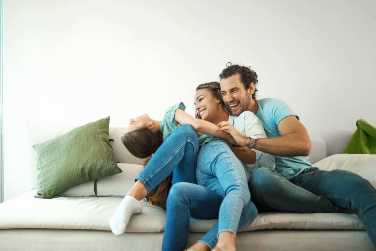  Family relaxing on the couch at Gleneagles Apartments in Lexington, Kentucky 