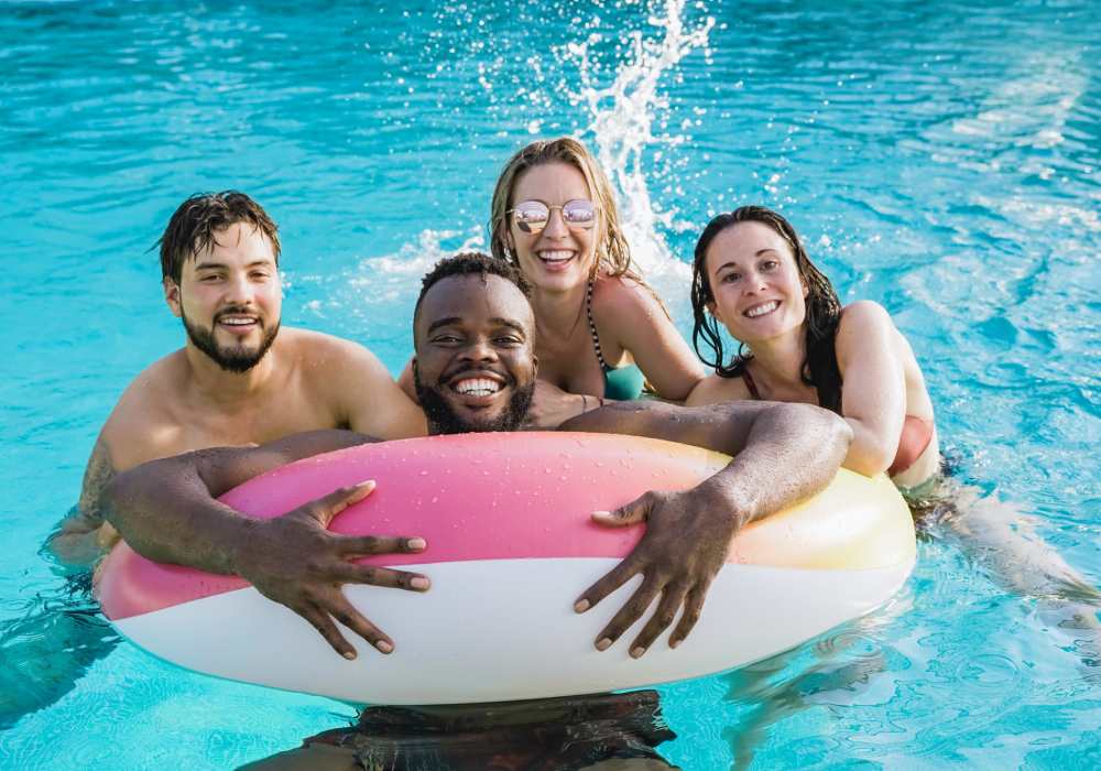 Resident enjoying in the community swimming pool at Amber Oaks in Pearland, Texas