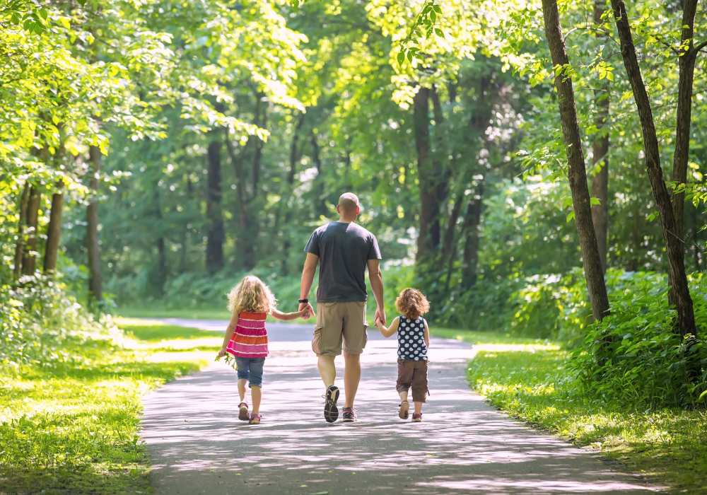 A resident man walking with his kids at a park near Villa Montanaro in Pleasant Hill,California