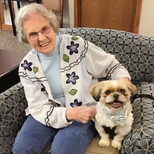 A resident with her dog at Glen Carr House Memory Care in Derby, Kansas