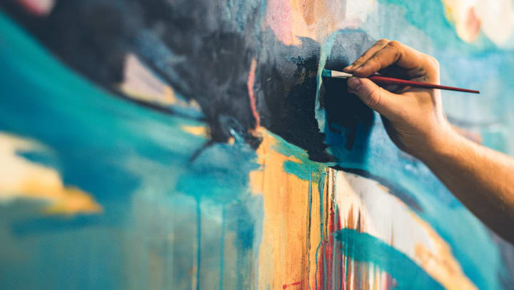 close up of an artist painting a contemporary art piece | unique works to find at the In-Town gallery near Ooltewah