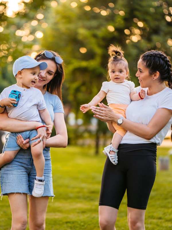 Residents with her kids walking in the park near Cherokee Summit Apartments in Acworth, Georgia