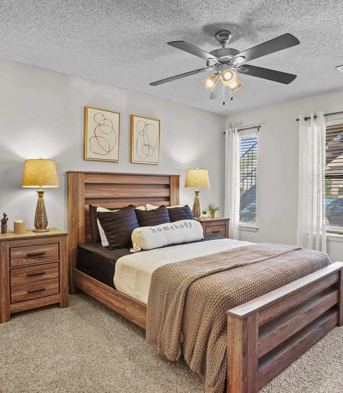 Spacious carpeted bedroom at Polo Run Apartments in Tulsa, Oklahoma