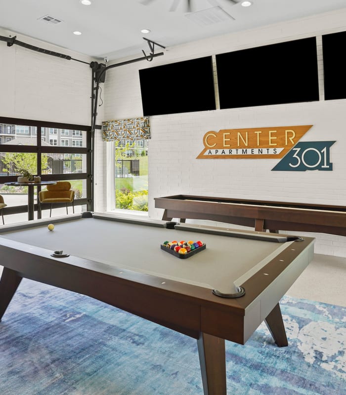Billiards and shuffle board at Center 301 Apartments in Belton, Missouri