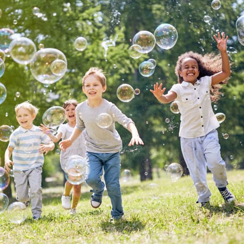Children playing with bubbles at Eucalyptus Ridge in Lakeside, California